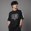 Man wearing black oversized drop shoulder t-shirt with white shoulder taping - Global Hub Pakistan