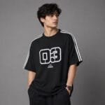 Black oversized t-shirt Pakistan Man wearing black oversized drop shoulder t-shirt with white shoulder taping - Global Hub Pakistan