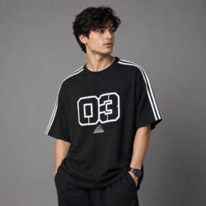Black oversized t-shirt Pakistan Man wearing black oversized drop shoulder t-shirt with white shoulder taping - Global Hub Pakistan