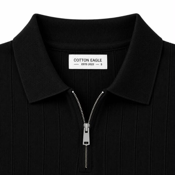 Half zip black polo collar Close up of the black polo collar, half zip and Cotton Eagle neck label