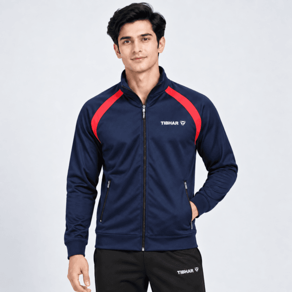 Tibhar raglan training jacket in navy with red shoulder panel, full zip, worn by model