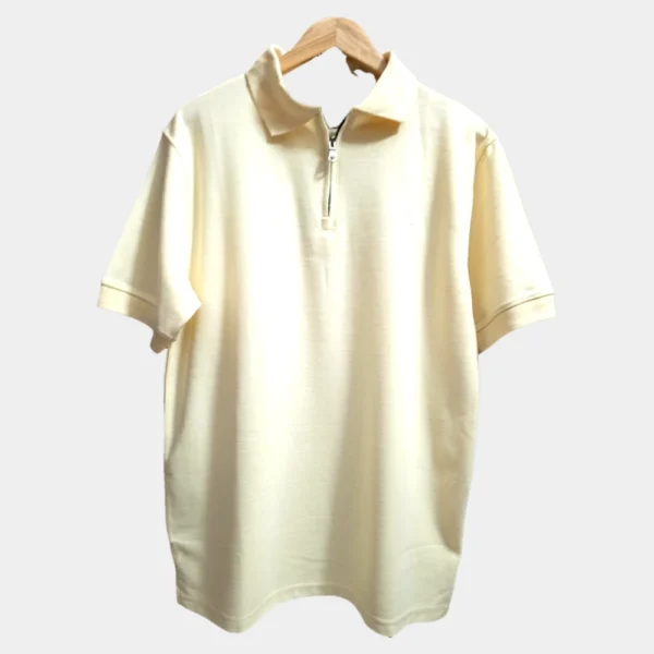 Sportlux Plus beige quarter zip polo photographed on a hanger, front view showing the real fabric, off-white embroidered S and SPORTLUX PLUS neck label