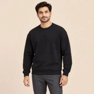 Man wearing the Sportlux Plus black crewneck sweatshirt with charcoal trousers, regular fit, front view