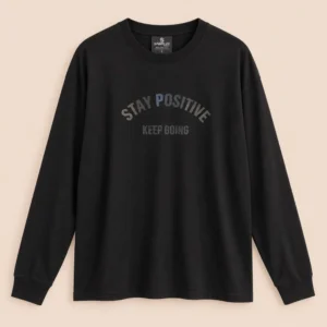 Sportlux Plus black oversized full sleeve t-shirt with tonal STAY POSITIVE KEEP GOING chest print, drop shoulder, rib collar and cuffs, flat lay