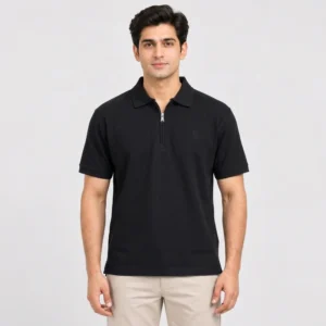 Sportlux Plus black quarter zip polo front Man wearing a Sportlux Plus black quarter zip polo in fine cotton pique, front view, silver metal zip and tonal black embroidered S on the left chest