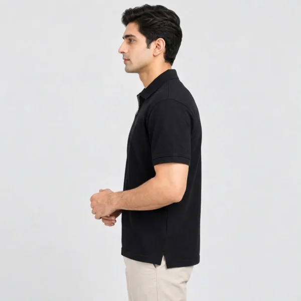 Side view of the Sportlux Plus black quarter zip polo showing the regular fit, sleeve length and open side vent at the hem