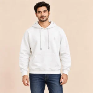 Man wearing the Sportlux Plus cream 350 GSM fleece hoodie with tonal embroidered S monogram, relaxed fit, kangaroo pocket, front view