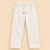 Sportlux Plus cream 350 GSM fleece trousers, straight leg, elastic drawcord waistband, side pockets and tonal embroidered S monogram, flat lay