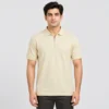 Man wearing the Sportlux Plus cream quarter zip polo in size Medium, front view, regular fit with room through the chest, silver metal zip and tonal S on the left chest