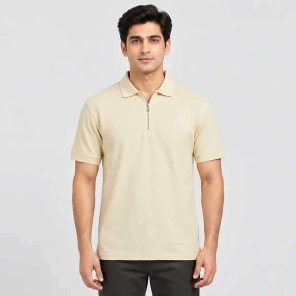 Man wearing the Sportlux Plus cream quarter zip polo in size Medium, front view, regular fit with room through the chest, silver metal zip and tonal S on the left chest