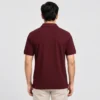 Back view of a man wearing the Sportlux Plus maroon quarter zip polo, plain back, ribbed sleeve bands and side vents at the hem
