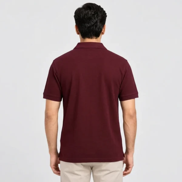 Back view of a man wearing the Sportlux Plus maroon quarter zip polo, plain back, ribbed sleeve bands and side vents at the hem