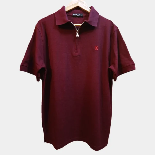Sportlux Plus maroon quarter zip polo photographed on a hanger, front view showing the real fabric, red embroidered S and SPORTLUX PLUS neck label