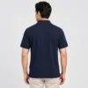 Back view of a man wearing the Sportlux Plus navy quarter zip polo, plain back, ribbed sleeve bands and side vents at the hem