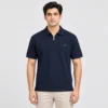 Man wearing a Sportlux Plus navy quarter zip polo in fine cotton pique, front view, silver metal zip and blue embroidered S on the left chest