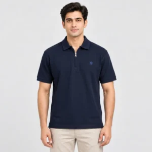 Sportlux Plus navy quarter zip polo front Man wearing a Sportlux Plus navy quarter zip polo in fine cotton pique, front view, silver metal zip and blue embroidered S on the left chest