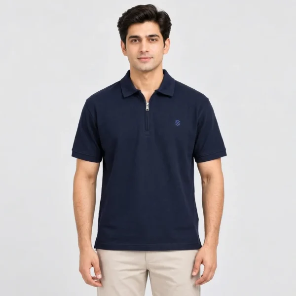 Man wearing a Sportlux Plus navy quarter zip polo in fine cotton pique, front view, silver metal zip and blue embroidered S on the left chest