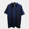 Sportlux Plus navy quarter zip polo photographed on a hanger, front view showing the real fabric, blue embroidered S and SPORTLUX PLUS neck label