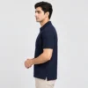 Side view of the Sportlux Plus navy quarter zip polo showing the regular fit, sleeve length and open side vent at the hem