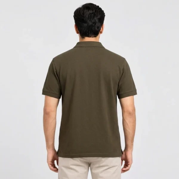 Back view of a man wearing the Sportlux Plus olive quarter zip polo, plain back, ribbed sleeve bands and side vents at the hem