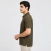 Side view of the Sportlux Plus olive quarter zip polo showing the regular fit, sleeve length and open side vent at the hem